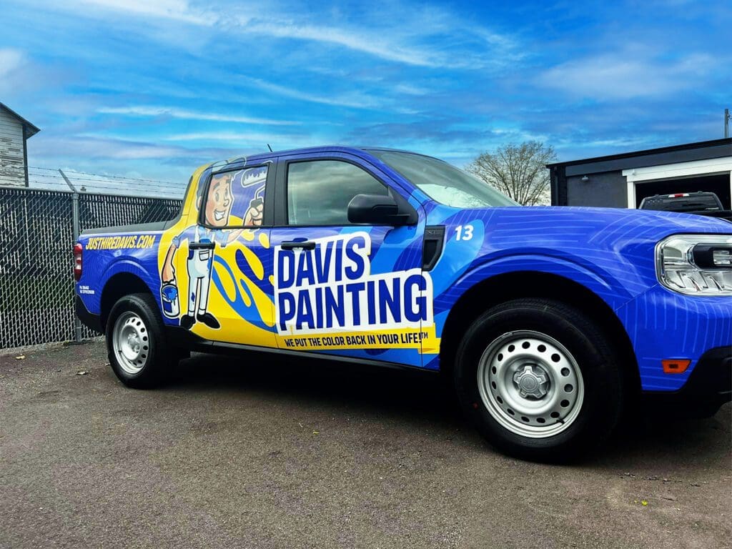 Wrapped Ford Maverick with our Davis Painting yellow and blues with mascot Brushy on the side.