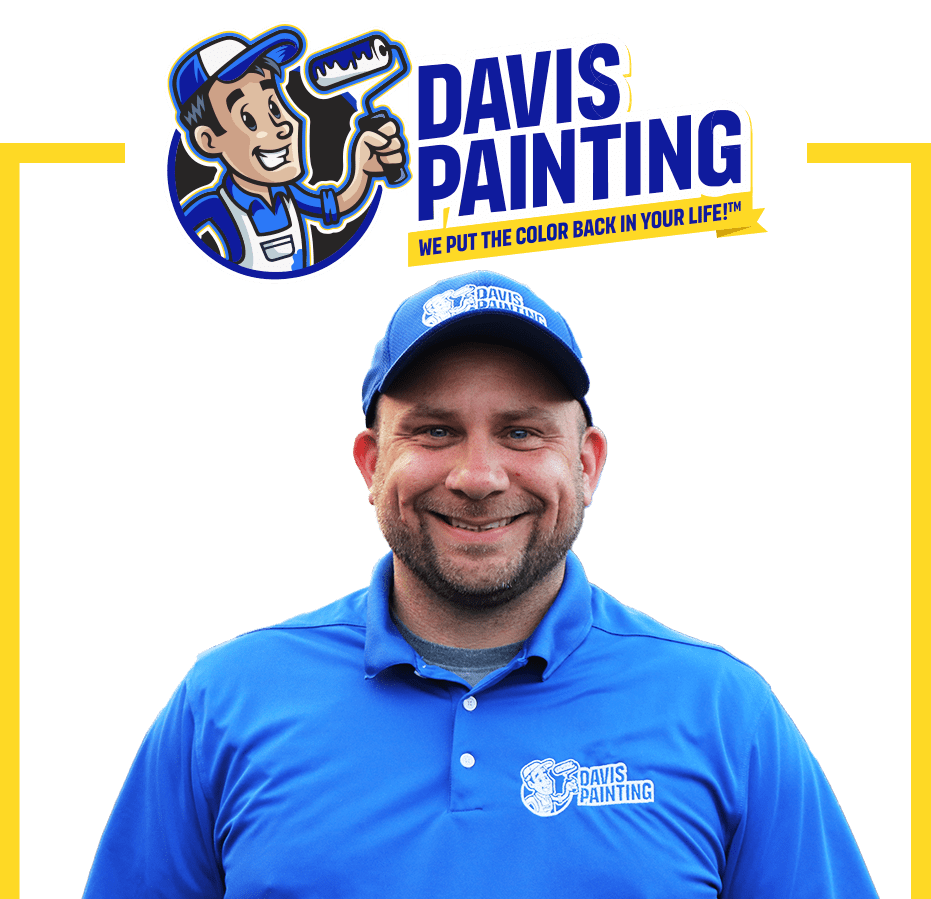 A smiling man in a blue Davis Painting shirt and cap stands below the Davis Painting logo, featuring a cartoon painter and their slogan, "We put the color back in your life™." Yellow lines frame this vibrant Davis Painting image.