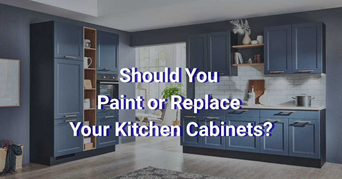 Modern kitchen with dark blue cabinets, white countertop, open shelving, and white tile backsplash. Large text in the center reads: "Should You Paint or Replace Your Kitchen Cabinets?.